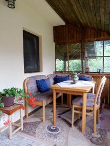 a living room with a couch and a table at Casa Valer Arieseni in Arieşeni