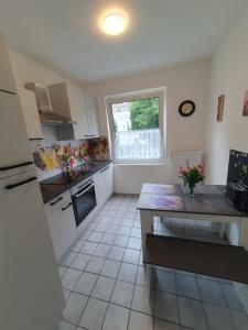 a kitchen with a counter and a window in it at Appartement in Gelsenkirchen in Gelsenkirchen