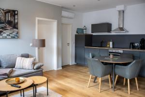 a living room with a couch and a table at Pension Wagener in Wachtendonk