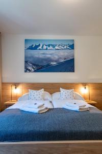Postel nebo postele na pokoji v ubytování Hotel Jasná