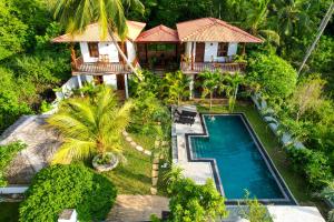 an aerial view of a villa with a swimming pool at The lookout lodge in Tangalle