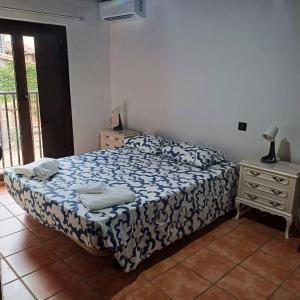 a bedroom with a bed and a dresser and a window at La Posada De Alanah in Candeleda +34 photos
