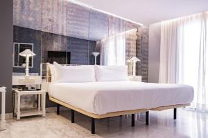 Postel nebo postele na pokoji v ubytování AZZ Mérida Medea Hotel