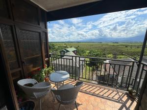 a balcony with chairs and a view of a field at Elles apartment in K'obulet'i