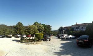 a parking lot with a lot of cars parked at Philoxenia in Kavála