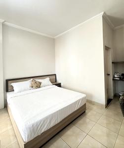 Ένα ή περισσότερα κρεβάτια σε δωμάτιο στο Capital Panorama Guest House Syariah