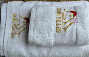 two towels with writing on them on a table at HOEI villas Fujisan全景 富士山 河口湖中心区 in Fujikawaguchiko +70 photos