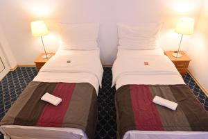 Postel nebo postele na pokoji v ubytování Pirin rooms