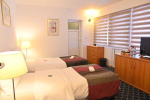 Postel nebo postele na pokoji v ubytování Pirin rooms