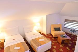 Postel nebo postele na pokoji v ubytování Pirin rooms