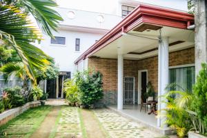 a house with a red roof at Caliah Homes in Balamban