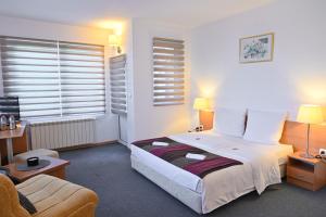 Postel nebo postele na pokoji v ubytování Pirin rooms