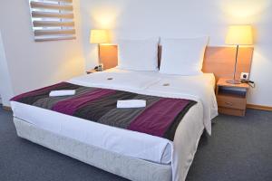 Postel nebo postele na pokoji v ubytování Pirin rooms