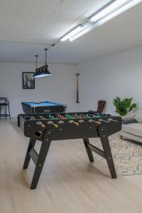 a pool table in the middle of a room at Diamond Villa, luxury house with private pool in Lourinhã