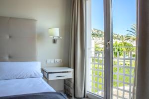 Postel nebo postele na pokoji v ubytování Hotel Atlántico