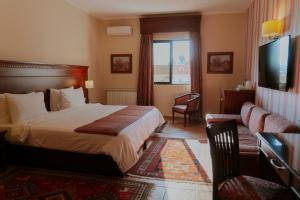 Postel nebo postele na pokoji v ubytování Le Cedrus Hotel