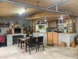 a kitchen with a table and chairs in a room at Guesthouse Family in Batumi
