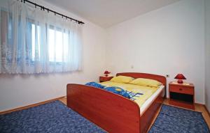 Postel nebo postele na pokoji v ubytování Apartments Davor