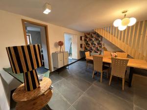 a dining room with a table and chairs at Hiša Blašč Wellness in Kobarid +34 photos