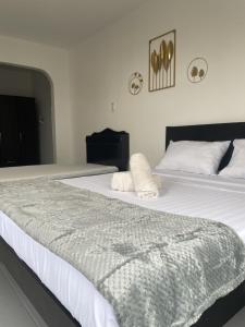 Postel nebo postele na pokoji v ubytování Hotel Sisters Inn