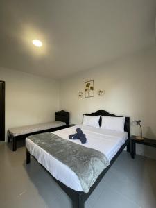 Postel nebo postele na pokoji v ubytování Hotel Sisters Inn