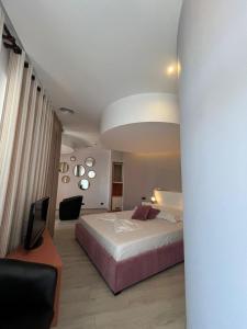 Postel nebo postele na pokoji v ubytování Icon Hotel