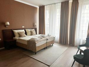 Postel nebo postele na pokoji v ubytování Wellness Hotel Pivovar Monopol