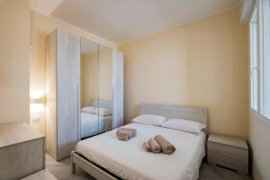 Ένα ή περισσότερα κρεβάτια σε δωμάτιο στο Residence i Portici
