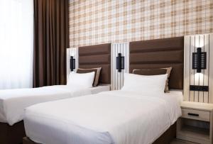 Postel nebo postele na pokoji v ubytování Hotel Innception