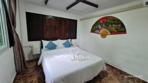 Letto o letti in una camera di Koh Mak Garden View