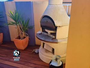 a pizza oven sitting on top of a wooden floor at Absolute Water Frontage w/ Jetty + Boat Ramp in Hindmarsh Island