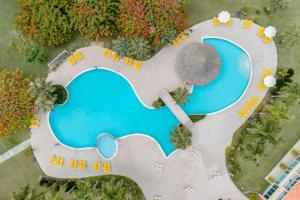 an overhead view of a swimming pool at a resort at Hodelpa Garden Suites - All Inclusive in Juan Dolio