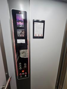a refrigerator with a sign on the side of it at Euromiko apartment in Trenčín