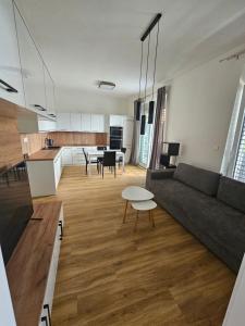 a living room with a couch and a table at Euromiko apartment in Trenčín