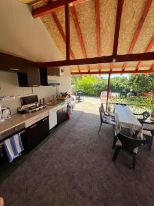 a kitchen with a table and a counter top at Casa Dorina in Techirghiol