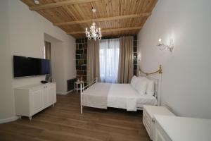 Ένα ή περισσότερα κρεβάτια σε δωμάτιο στο Ser In Hotel