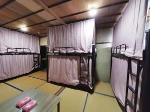 Кровать или кровати в номере ラッコ ゲストハウス 海獭青旅 Sea Otter Guest House