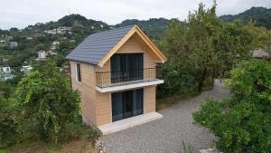 a small house with a balcony on a hill at B-XON Makhinjauri in Batumi