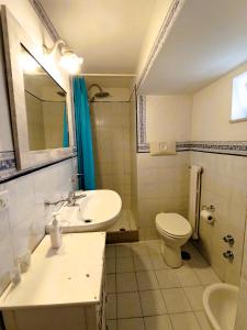 a bathroom with a sink and a toilet at La Dimora di Donna Cecilia in Bari