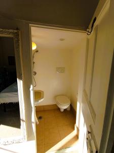 a small bathroom with a toilet and a sink at La Dimora di Donna Cecilia in Bari +14 photos