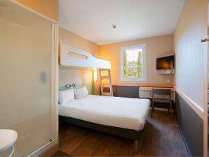 Postel nebo postele na pokoji v ubytování Ibis Budget Manosque Cadarache
