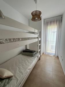 Ένα ή περισσότερα κρεβάτια σε δωμάτιο στο Valltonic Residencial Portonovo