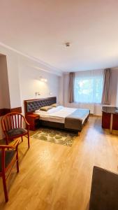 Posteľ alebo postele v izbe v ubytovaní Hotel Chata Za Wsią