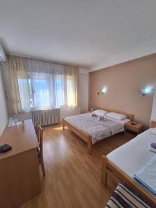 Postelja oz. postelje v sobi nastanitve Hotel Konaciste Trstenik