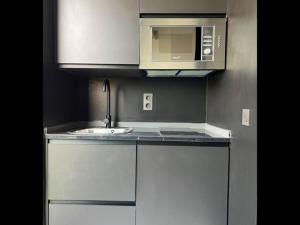 Kuchyň nebo kuchyňský kout v ubytování Innova Spaces Málaga