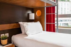 Voodi või voodid majutusasutuse Première Classe Lyon Centre Gare Part Dieu toas