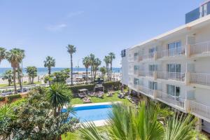 an aerial view of a hotel with a pool and the ocean at Soho Boutique Las Vegas in Málaga