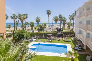 an aerial view of a hotel with a swimming pool and the beach at Soho Boutique Las Vegas in Málaga