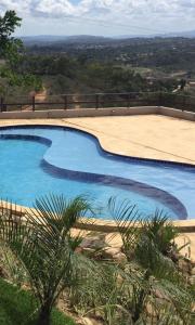 Πισίνα στο ή κοντά στο Flat Condomínio Topo da Montanha 507