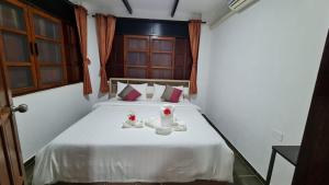 Letto o letti in una camera di Koh Mak Garden View
